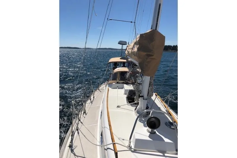 Slide: The Image of Sailing on a 1986 Mason 33 yacht, clear blue sea and sky in the background. - 21