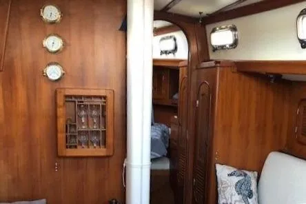 Slide: The Image of Interior of a 1986 Mason 33 yacht with wooden finish. - 4
