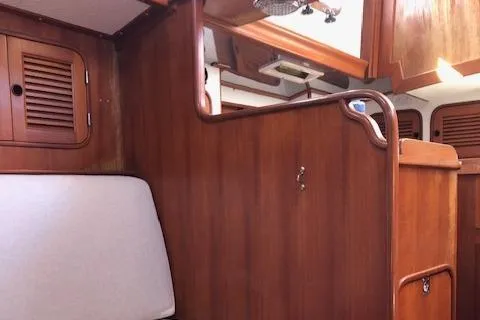 Slide: The Image of Interior of a 1986 Mason 33 yacht with wooden finish. - 5