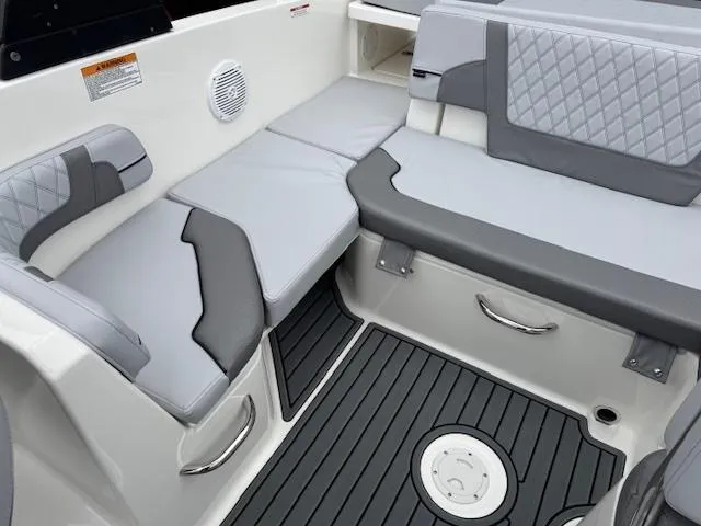 Slide: The Image of 2025 Bayliner VR6 Bowrider I/O interior with gray seating and modern design. - 10