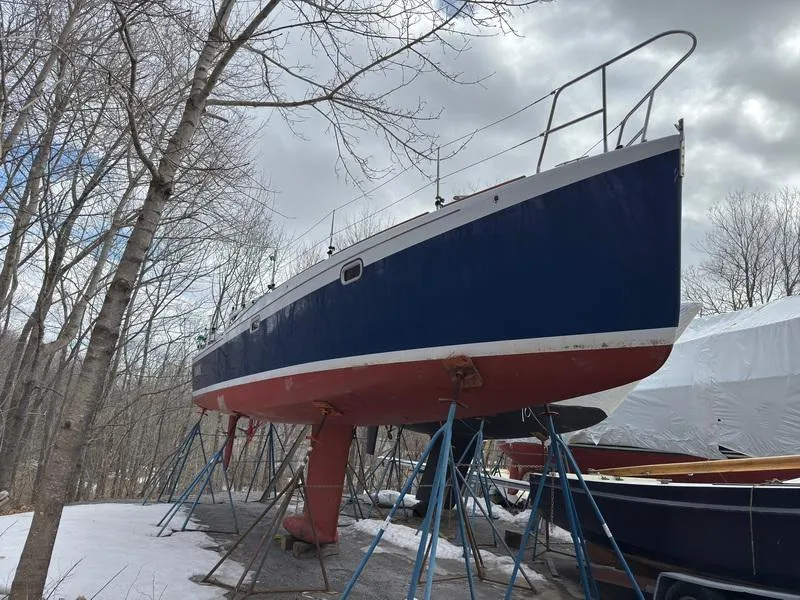 The Image of 2006 Robert Perry Far Harbour 39 sailboat on stands in a snowy yard. - 0