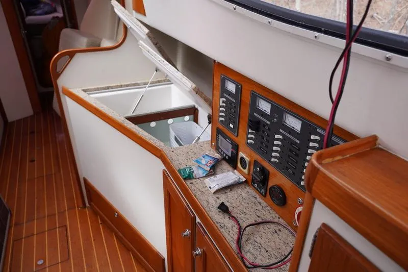Slide: The Image of Control panel and storage area inside 2006 Robert Perry Far Harbour 39 yacht. - 16