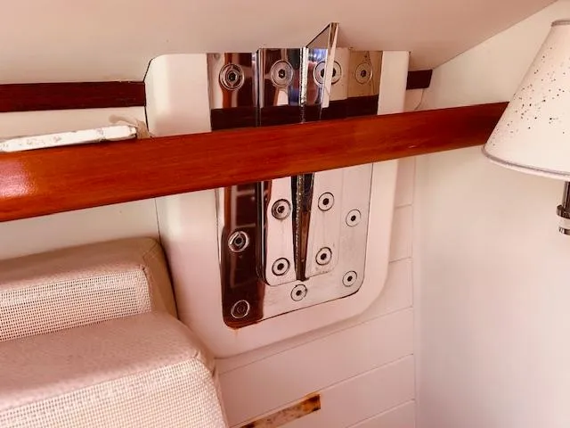 Slide: The Image of Interior detail of 2006 Robert Perry Far Harbour 39 yacht, featuring polished metal and wood accents. - 25
