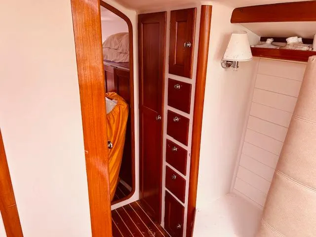 Slide: The Image of Interior of 2006 Robert Perry Far Harbour 39 yacht with wooden cabinetry and cozy design. - 26
