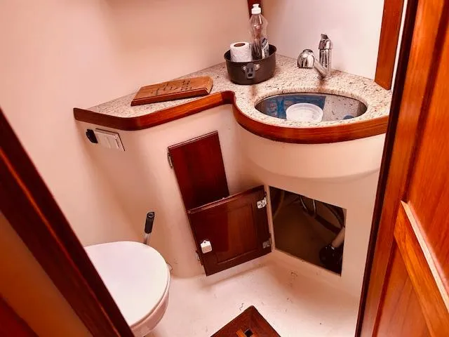 Slide: The Image of Compact bathroom in 2006 Robert Perry Far Harbour 39 yacht with sink and toilet. - 27