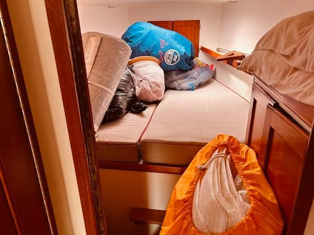 Slide: The Image of Cabin interior of 2006 Robert Perry Far Harbour 39 with storage items on bed. - 29