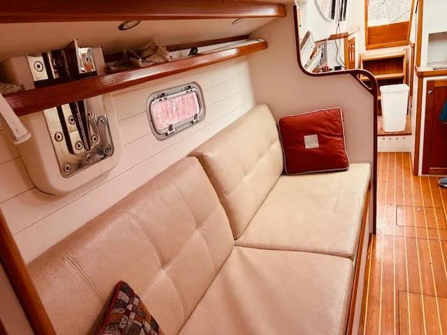 Slide: The Image of Interior of 2006 Robert Perry Far Harbour 39 yacht with beige seating and wooden accents. - 33
