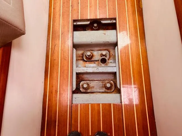 Slide: The Image of Wooden floor panel revealing metal components on a 2006 Robert Perry Far Harbour 39 yacht. - 34