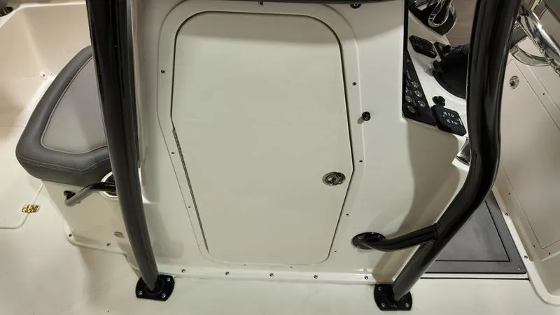 Slide: The Image of 2024 Sea Born LX 24 LE boat console with seating and storage compartment. - 11