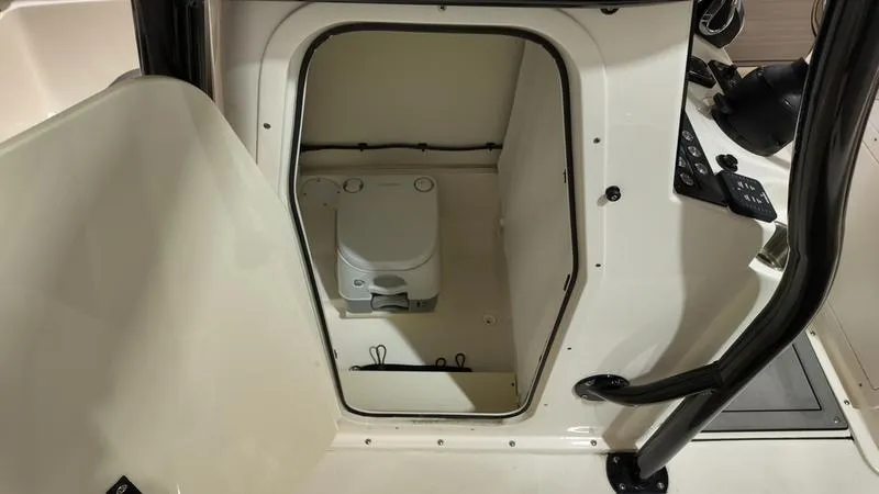 Slide: The Image of 2024 Sea Born LX 24 LE boat interior with compact marine toilet. - 12