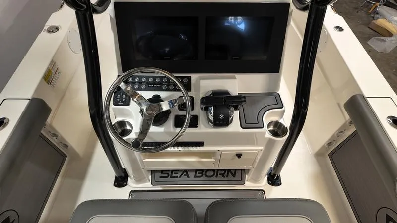 Slide: The Image of 2024 Sea Born LX 24 LE boat dashboard with steering wheel and controls. - 13