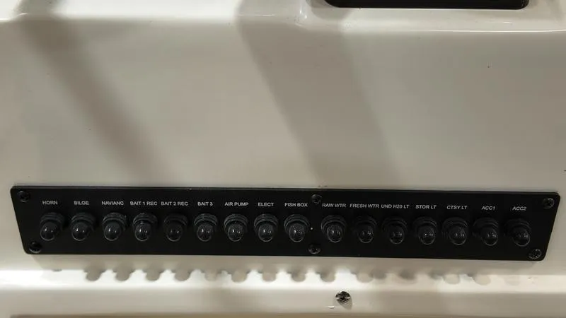 Slide: The Image of Control panel of 2024 Sea Born LX 24 LE boat with labeled switches. - 16