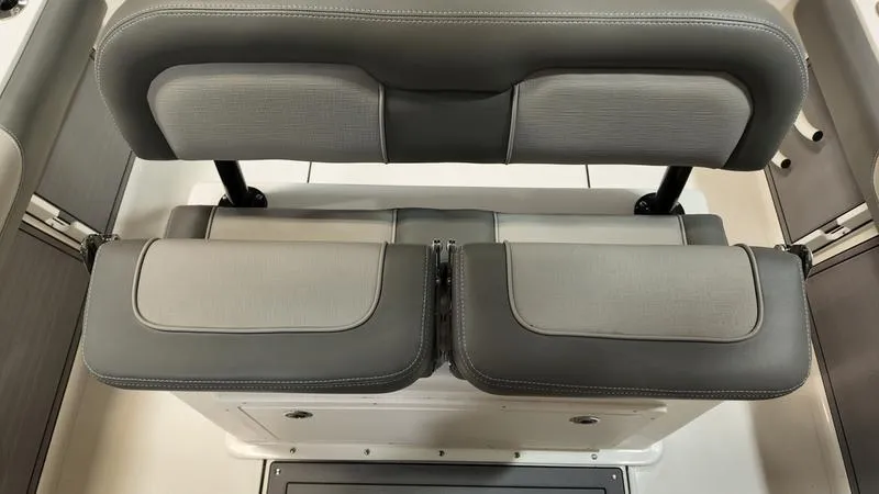 Slide: The Image of 2024 Sea Born LX 24 LE boat seating, featuring gray cushioned seats and backrest. - 20
