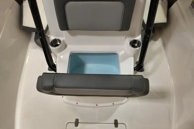 Slide: The Image of 2024 Sea Born LX 24 LE boat interior with seating and storage compartment. - 24