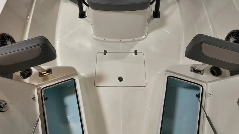 Slide: The Image of 2024 Sea Born LX 24 LE boat interior with seating and storage compartments. - 25