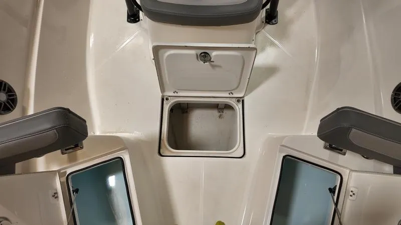 Slide: The Image of 2024 Sea Born LX 24 LE boat interior with storage compartments open. - 26