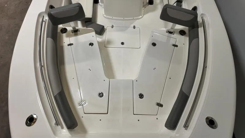 Slide: The Image of 2024 Sea Born LX 24 LE boat interior with seating and storage compartments. - 28