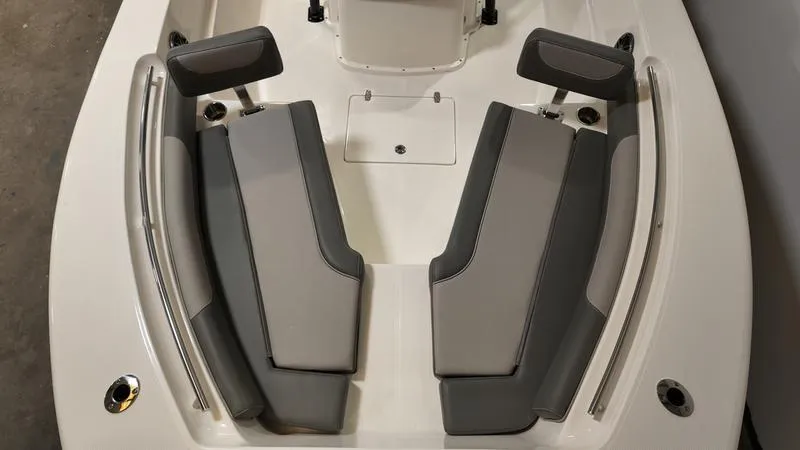 Slide: The Image of 2024 Sea Born LX 24 LE boat interior with gray cushioned seating. - 29
