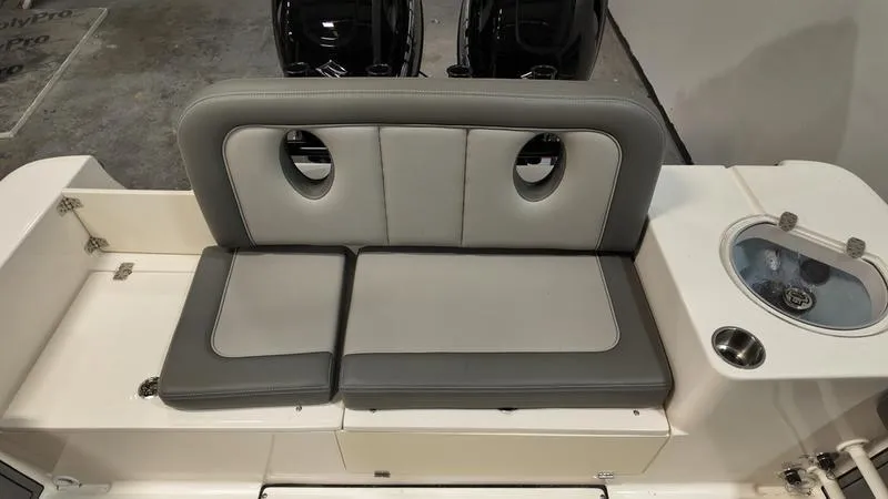 Slide: The Image of 2024 Sea Born LX 24 LE boat seating with gray cushions and integrated cup holder. - 4