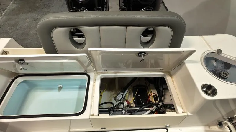 Slide: The Image of 2024 Sea Born LX 24 LE boat storage compartments and seating area. - 5