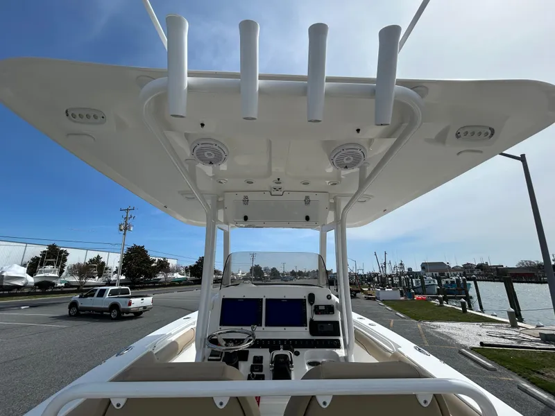 Slide: The Image of 2015 Sea Hunt Gamefish 30 boat helm with electronics, docked near marina. - 11