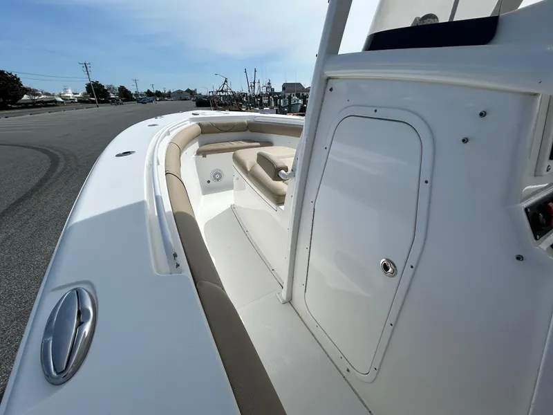 Slide: The Image of 2015 Sea Hunt Gamefish 30 boat deck with seating and storage compartment. - 15