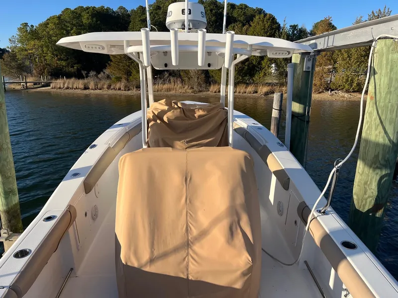 Slide: The Image of 2015 Sea Hunt Gamefish 30 with Coffin Box docked by a serene waterfront. - 25