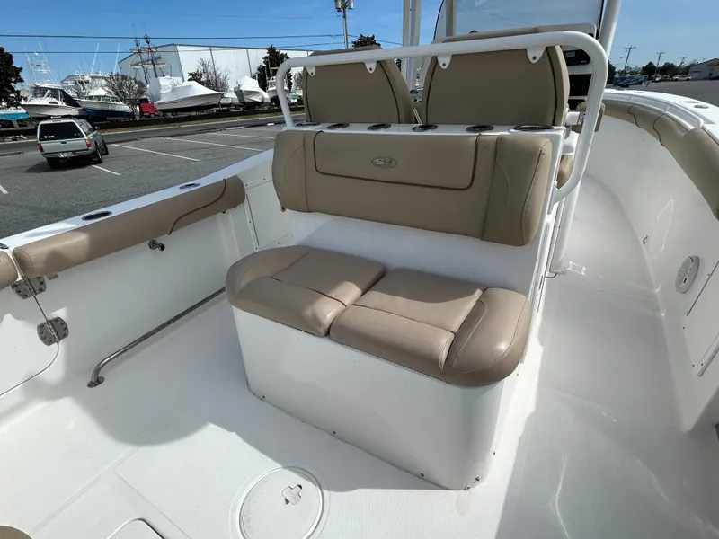 Slide: The Image of 2015 Sea Hunt Gamefish 30 interior with tan seating and coffin box. - 6