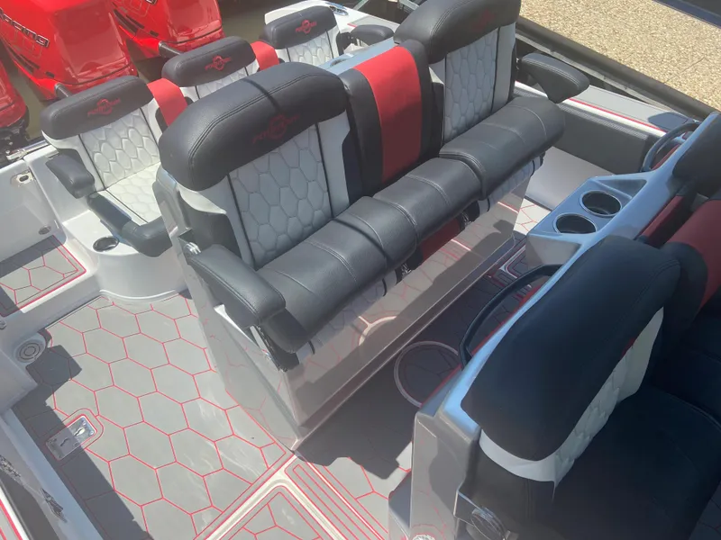 Slide: The Image of 2022 Fountain 38 SC boat interior with black and red seating, hexagonal floor pattern. - 15