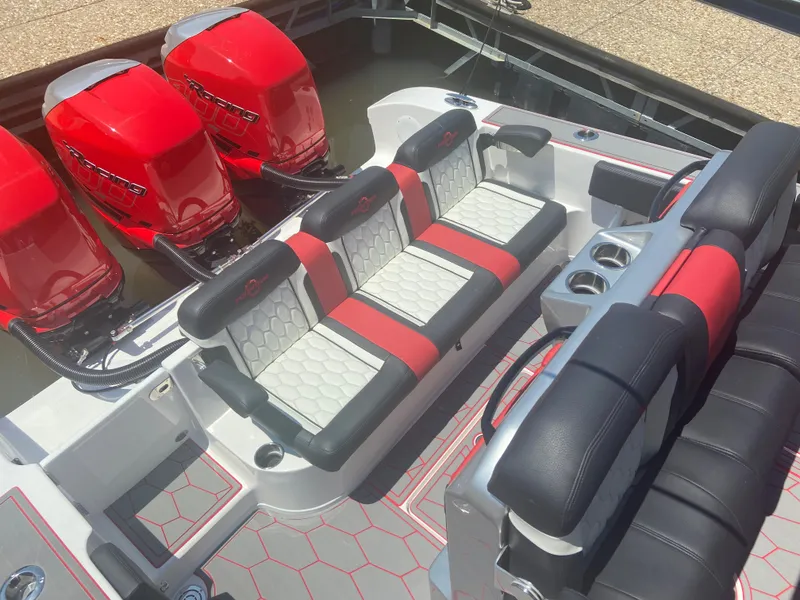Slide: The Image of 2022 Fountain 38 SC boat with red engines and stylish seating. - 16
