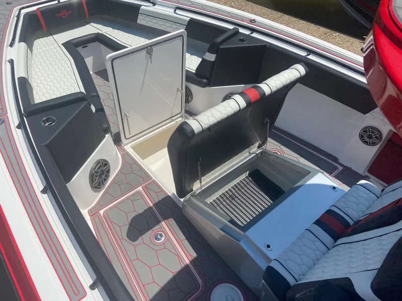 Slide: The Image of 2022 Fountain 38 SC boat interior with open storage compartments and seating. - 20
