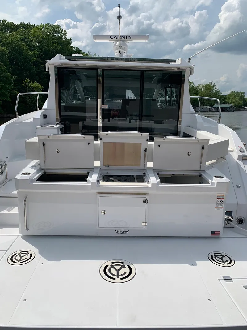 Slide: The Image of 2019 Cruisers Yachts 42 Cantius with outdoor kitchen, sleek design, and modern amenities. - 20
