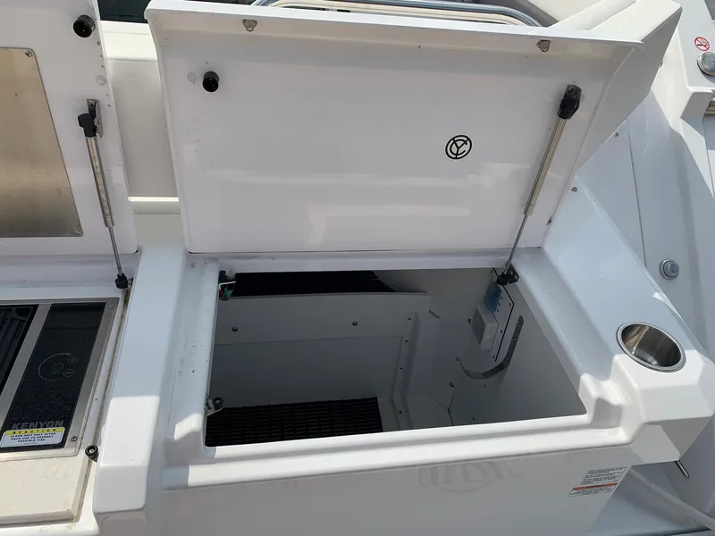 Slide: The Image of Open storage compartment on 2019 Cruisers Yachts 42 Cantius boat. - 21