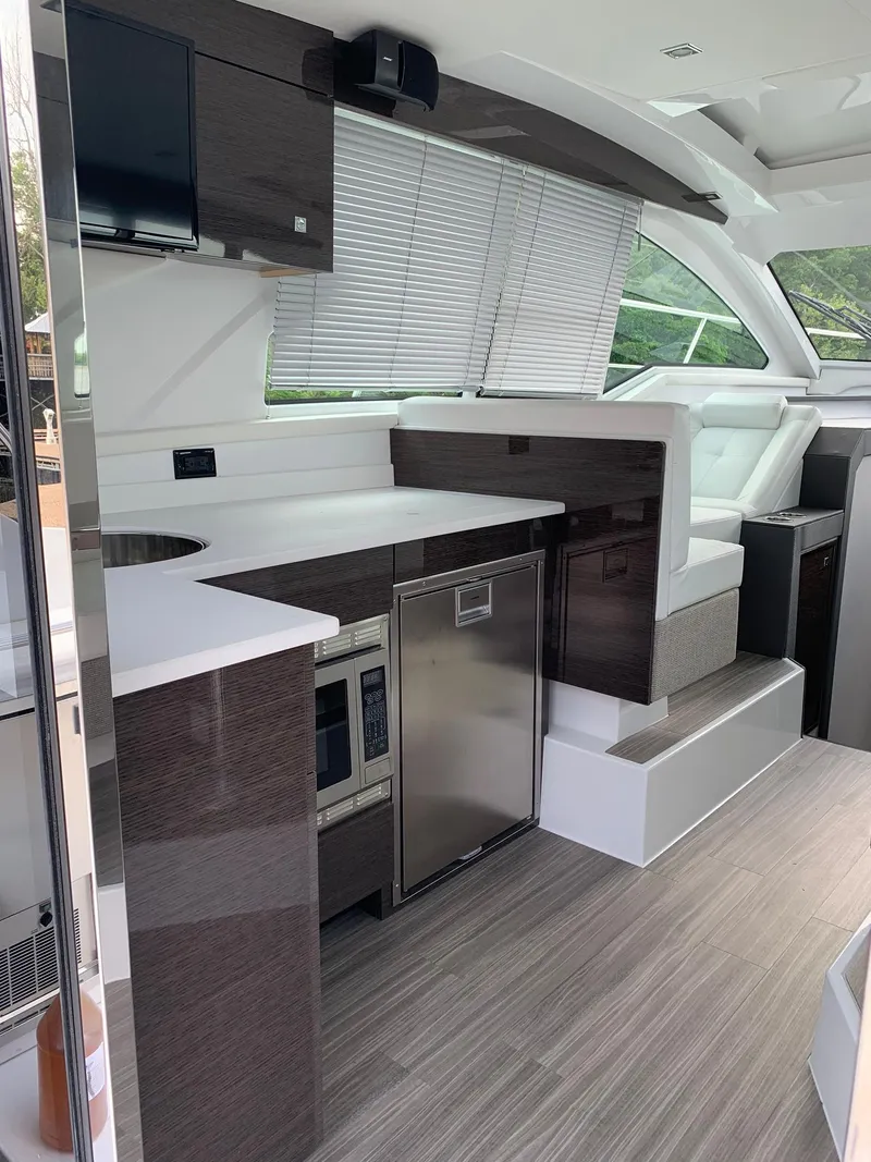 Slide: The Image of 2019 Cruisers Yachts 42 Cantius interior with modern kitchen and seating area. - 27