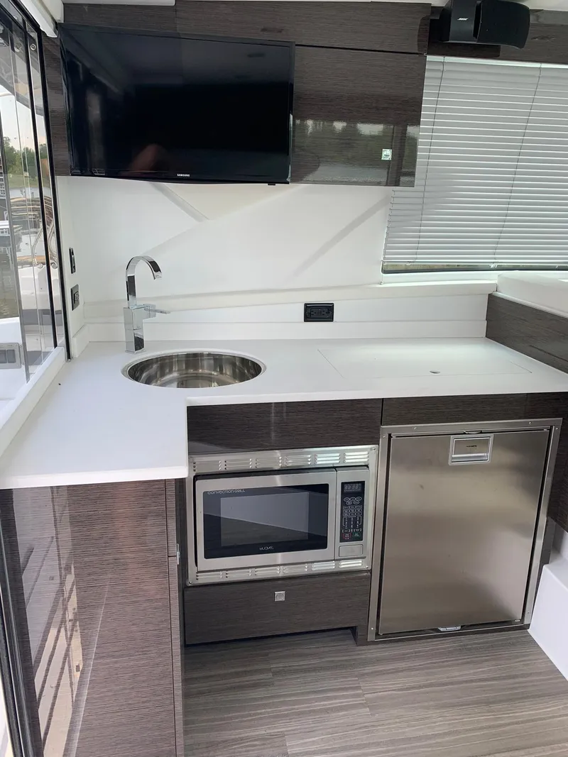 Slide: The Image of 2019 Cruisers Yachts 42 Cantius kitchen with modern appliances and sleek design. - 28