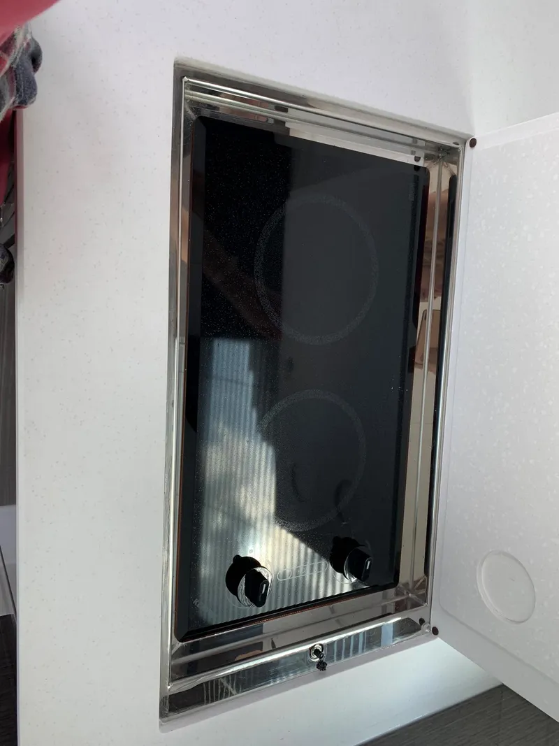 Slide: The Image of 2019 Cruisers Yachts 42 Cantius stovetop with two burners and sleek black finish. - 29