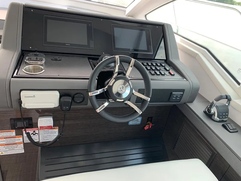 Slide: The Image of Helm of 2019 Cruisers Yachts 42 Cantius with dual displays and modern controls. - 32