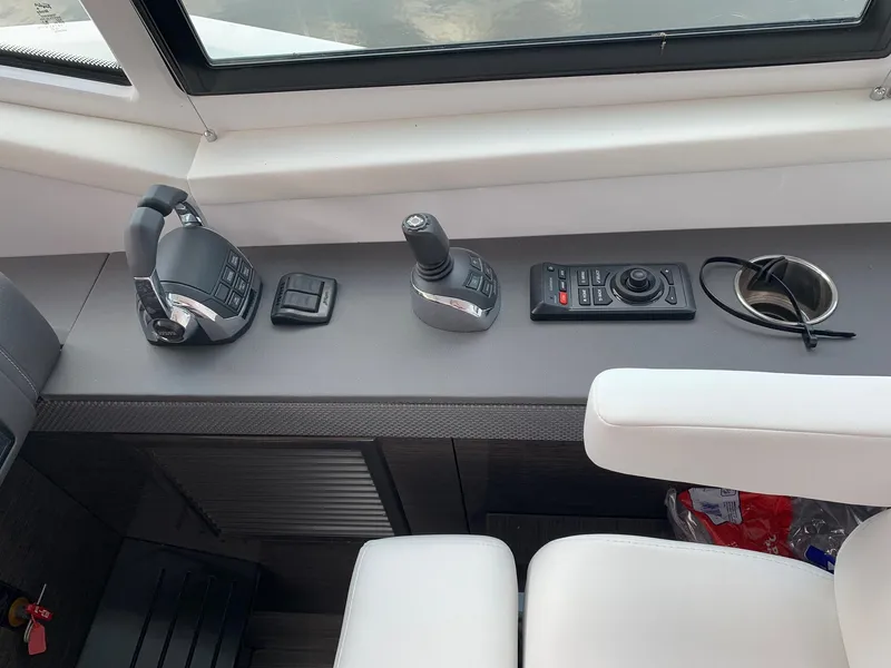 Slide: The Image of 2019 Cruisers Yachts 42 Cantius helm controls with joystick and throttle. - 33