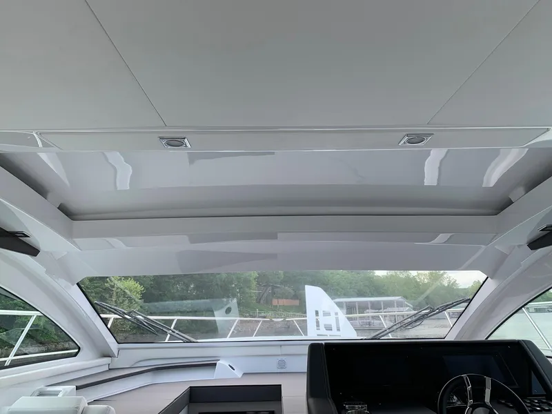 Slide: The Image of Interior view of 2019 Cruisers Yachts 42 Cantius helm with modern design and panoramic windows. - 35