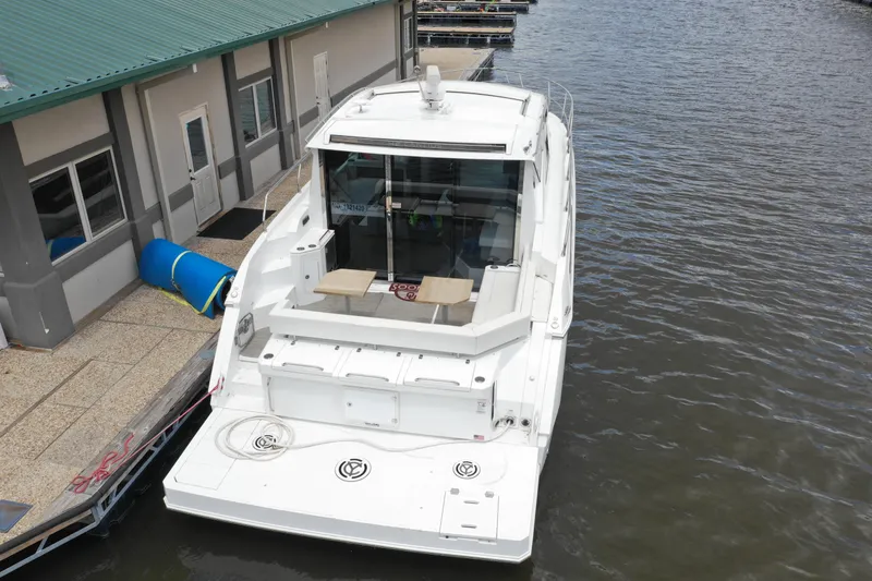 Slide: The Image of 2019 Cruisers Yachts 42 Cantius docked at marina, rear view. - 4