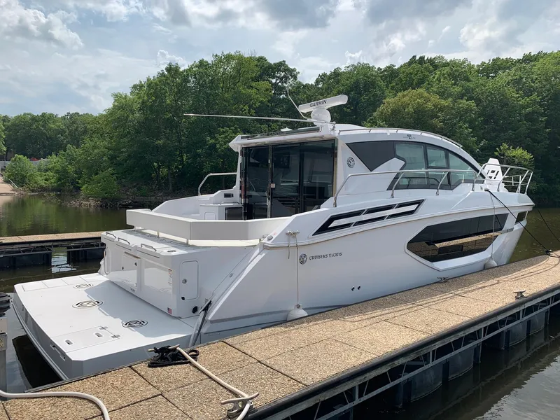 Slide: The Image of 2019 Cruisers Yachts 42 Cantius docked, featuring sleek design and modern amenities. - 6