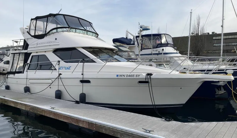 Slide: The Image of 1996 Bayliner 3788 Command Bridge Motoryacht docked at marina. - 1