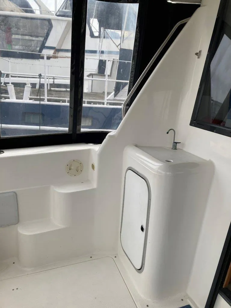 Slide: The Image of Interior view of 1996 Bayliner 3788 Command Bridge Motoryacht with steps and sink. - 11