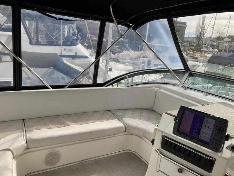 Slide: The Image of 1996 Bayliner 3788 Command Bridge Motoryacht interior with seating and navigation equipment. - 14
