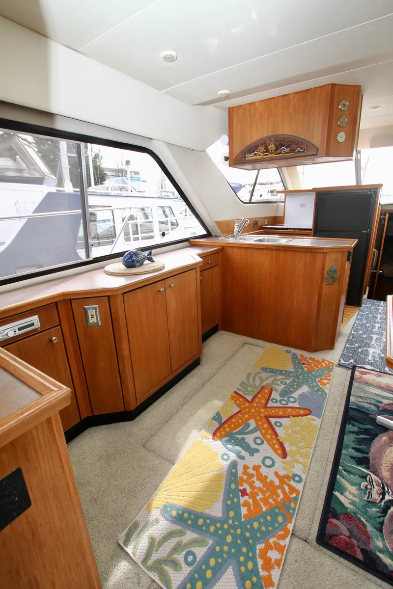 Slide: The Image of Interior of 1996 Bayliner 3788 Command Bridge Motoryacht with starfish-themed decor. - 16
