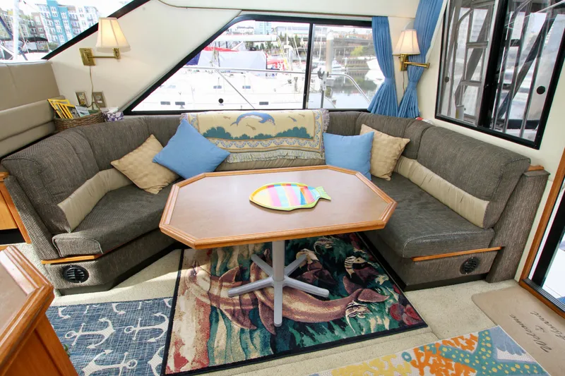 Slide: The Image of Interior of 1996 Bayliner 3788 Command Bridge Motoryacht with cozy seating and nautical decor. - 18