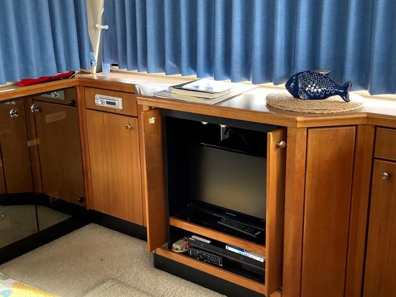 Slide: The Image of Interior of 1996 Bayliner 3788 Motoryacht with wooden cabinets and entertainment center. - 22
