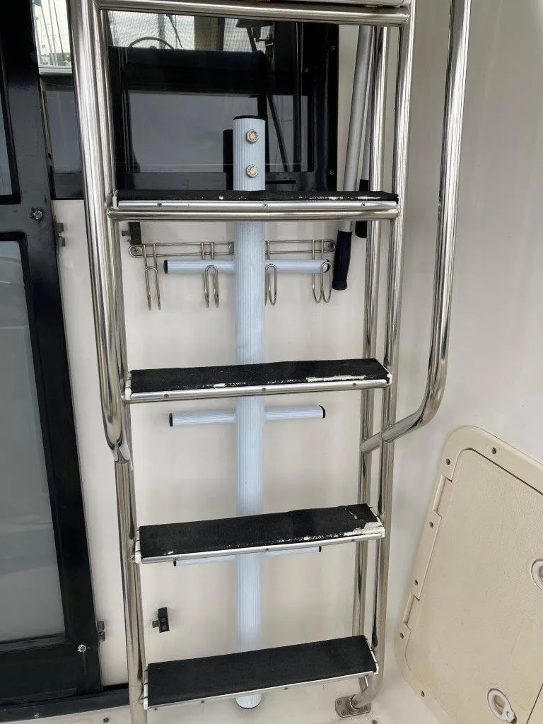 Slide: The Image of Stainless steel ladder on 1996 Bayliner 3788 Command Bridge Motoryacht. - 3