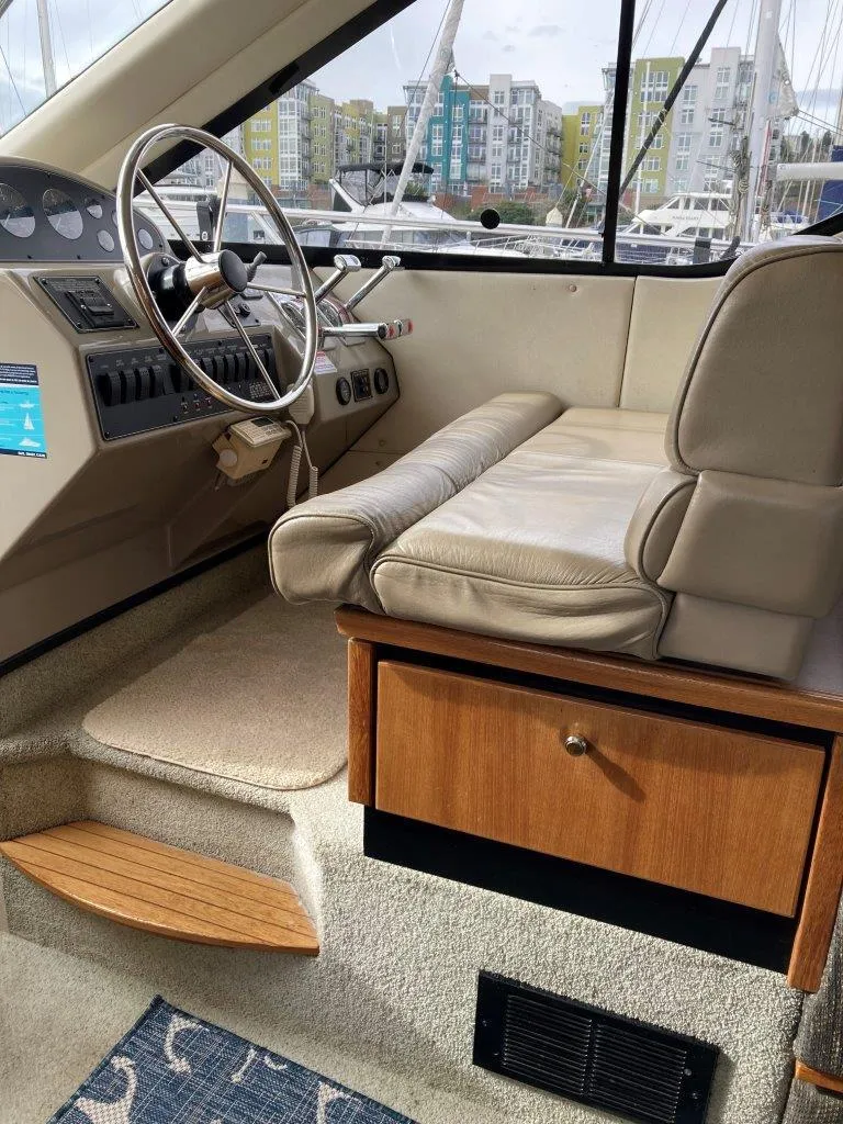 Slide: The Image of Interior of 1996 Bayliner 3788 Command Bridge Motoryacht with steering wheel and seating area. - 30