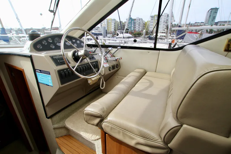 Slide: The Image of Interior helm of 1996 Bayliner 3788 Command Bridge Motoryacht with steering wheel and controls. - 31
